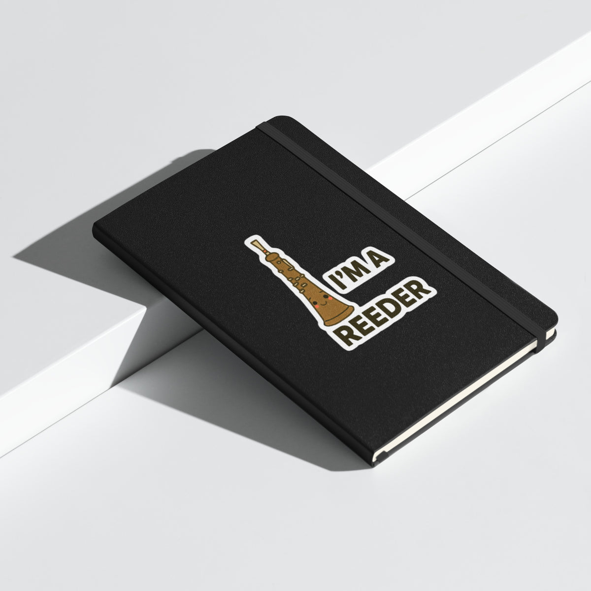 I’m a Reeder Oboe Pun Hardcover Notebook - Black angled closed mockup