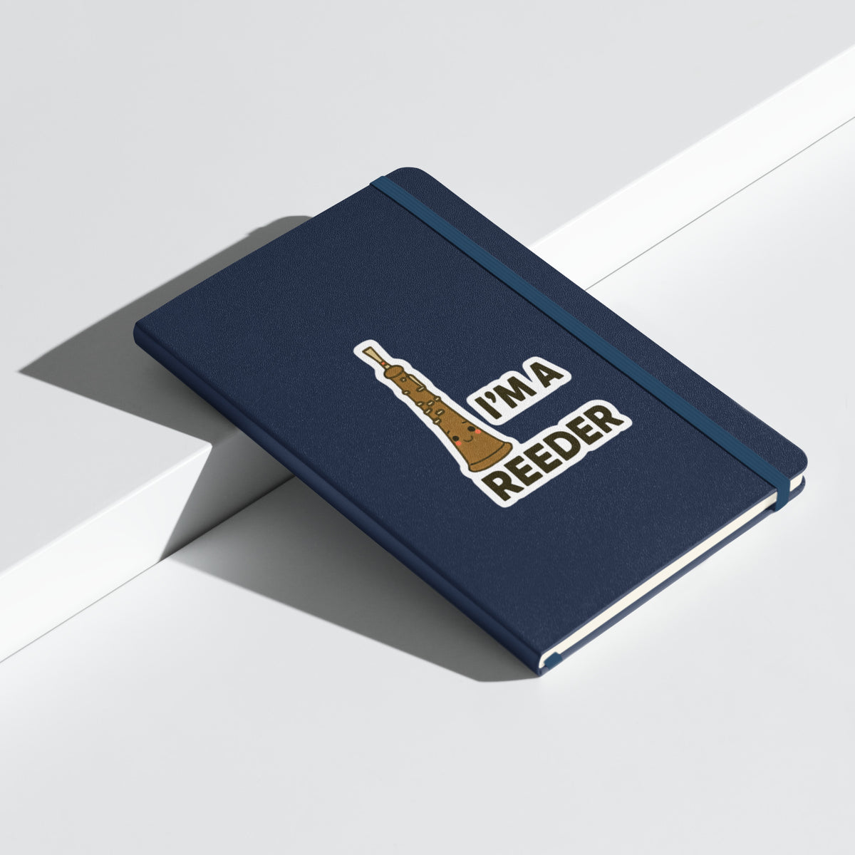 I’m a Reeder Oboe Pun Hardcover Notebook - Navy angled closed mockup