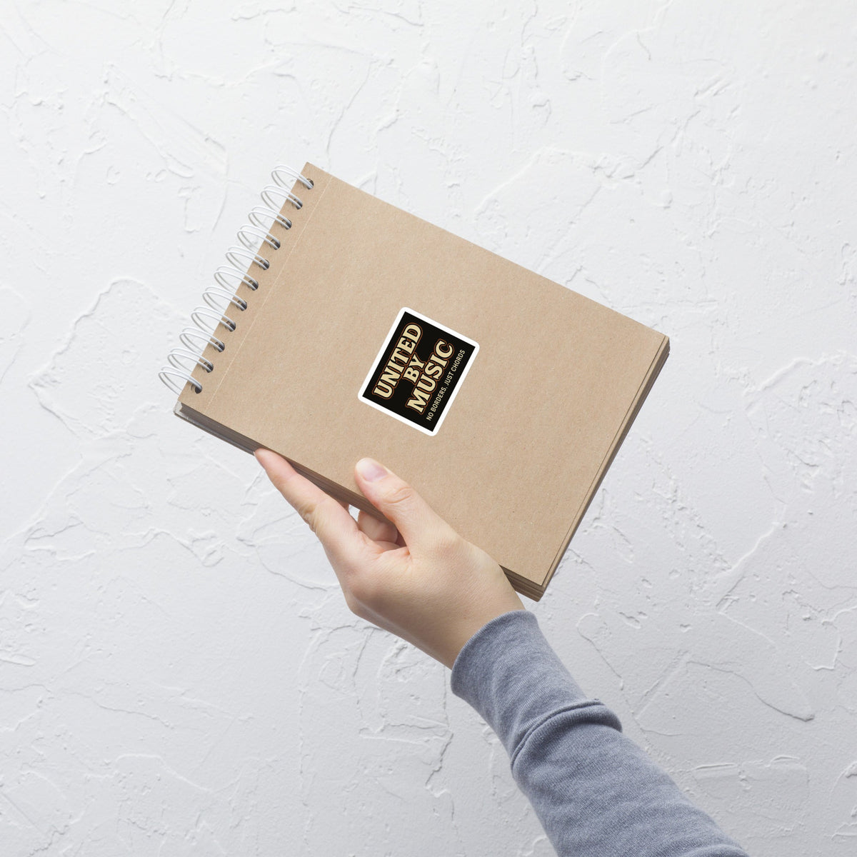 United by Music No Borders Just Chords Sticker notebook mockup 4 inch