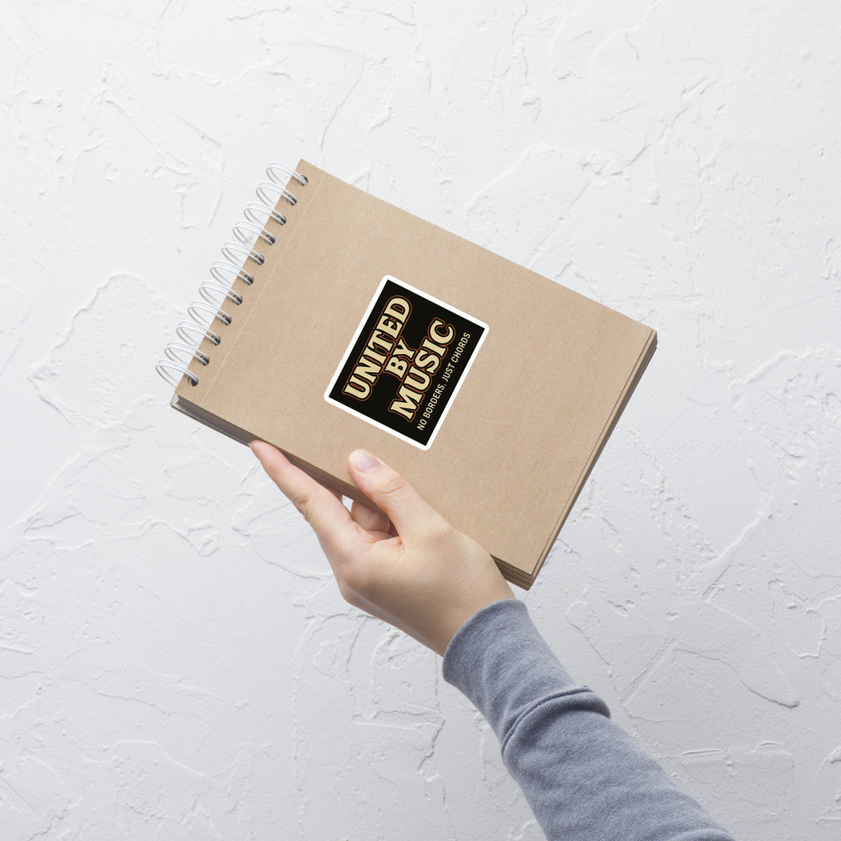 United by Music No Borders Just Chords Sticker notebook mockup 5.5 inch